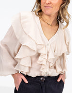 Kitty V Neck Ruffle Front Top in Beige