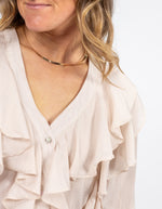 Kitty V Neck Ruffle Front Top in Beige