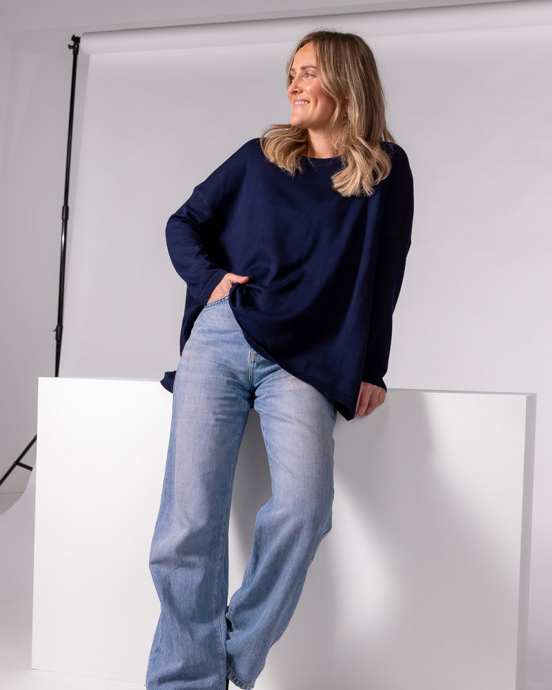 Oversized navy cotton-blend jumper featuring a crew neckline, long sleeves and a relaxed fluid drape.
