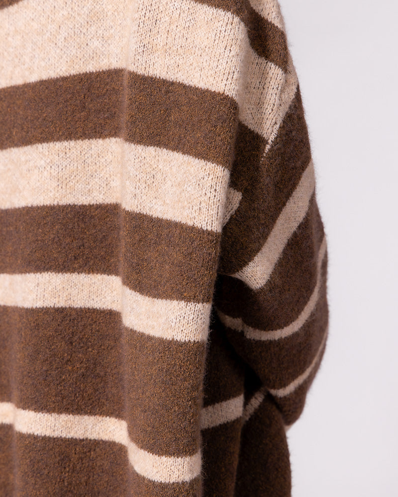 Bold brown and beige stripes define the soft brushed knit texture on the draped sleeve of this oversized jumper.