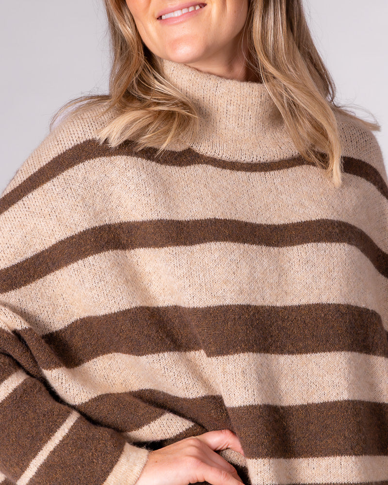 Brown striped oversized knit jumper featuring a relaxed funnel neck, drop shoulders, and soft brushed texture.