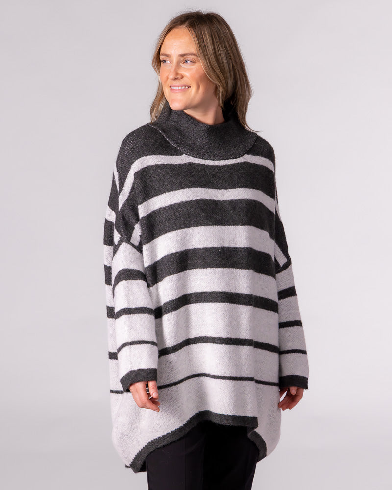 Oversized charcoal grey striped knit jumper featuring a relaxed funnel neck, drop shoulders, and a high-low hem.