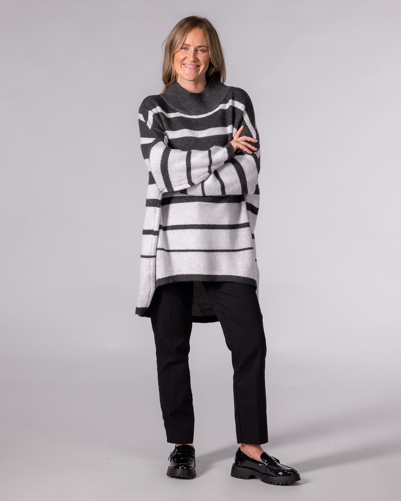 Oversized charcoal striped brushed knit jumper featuring a relaxed funnel neck and a prominent high-low hemline.