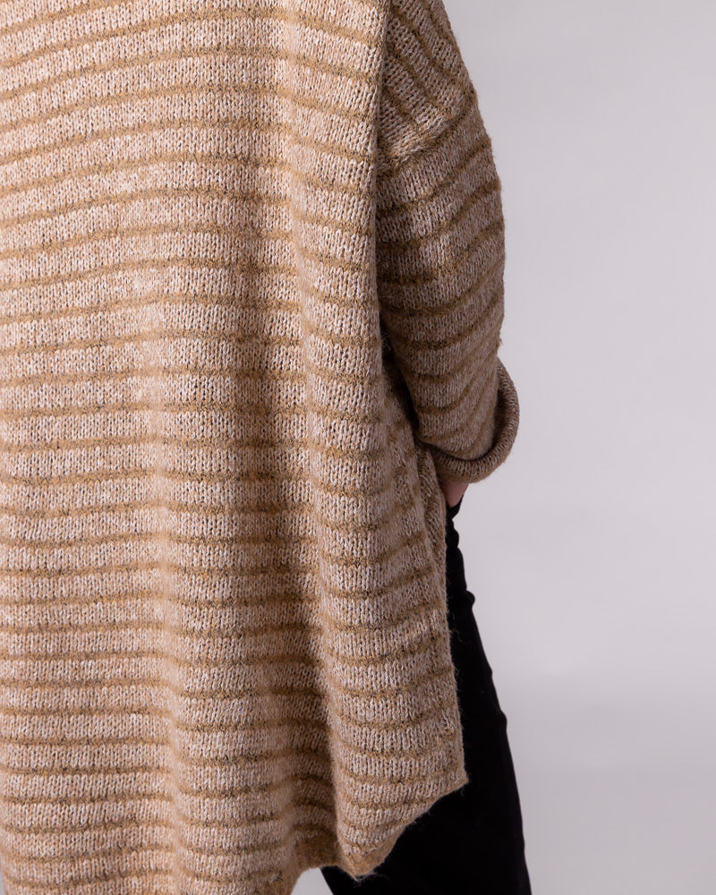 Textured beige and mocha striped knit jumper displaying an oversized side drape and scooped high-low hemline.