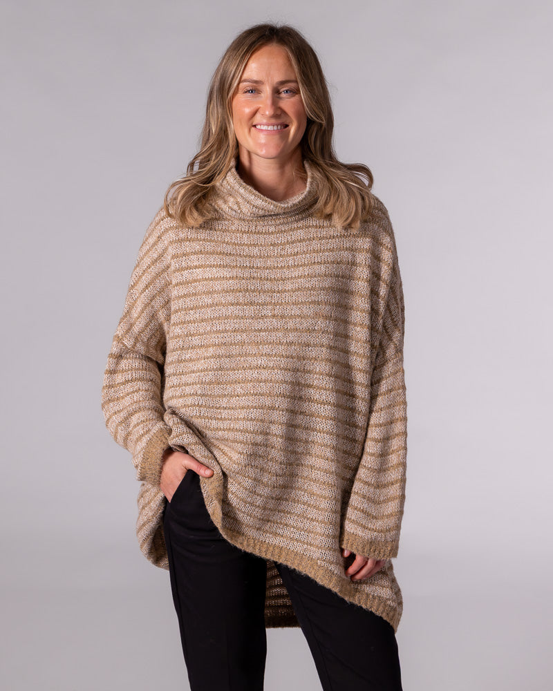 Oversized beige and mocha striped soft knit jumper with a relaxed funnel neck and drop-shoulder sleeves.