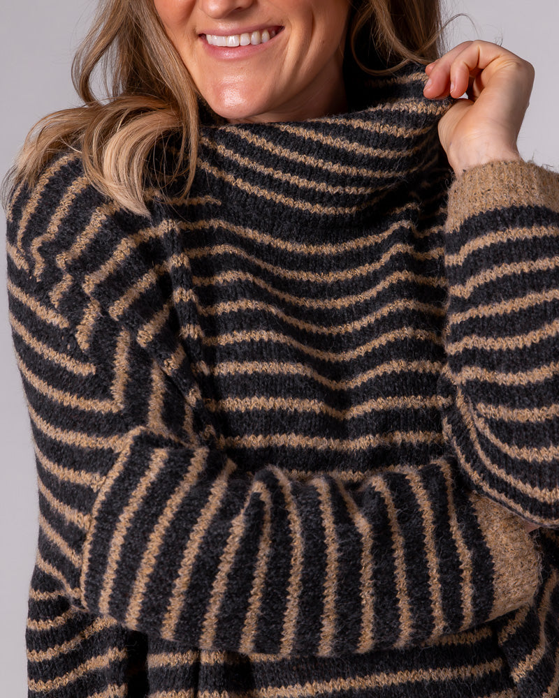 Black and mocha striped brushed knit jumper displaying a loose funnel neck and relaxed drop shoulders.