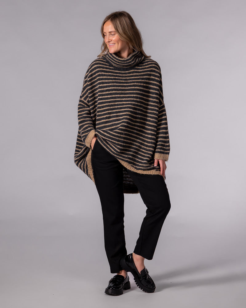 Oversized black and mocha striped brushed knit jumper featuring a funnel neck, drop shoulders and a scooped hem.