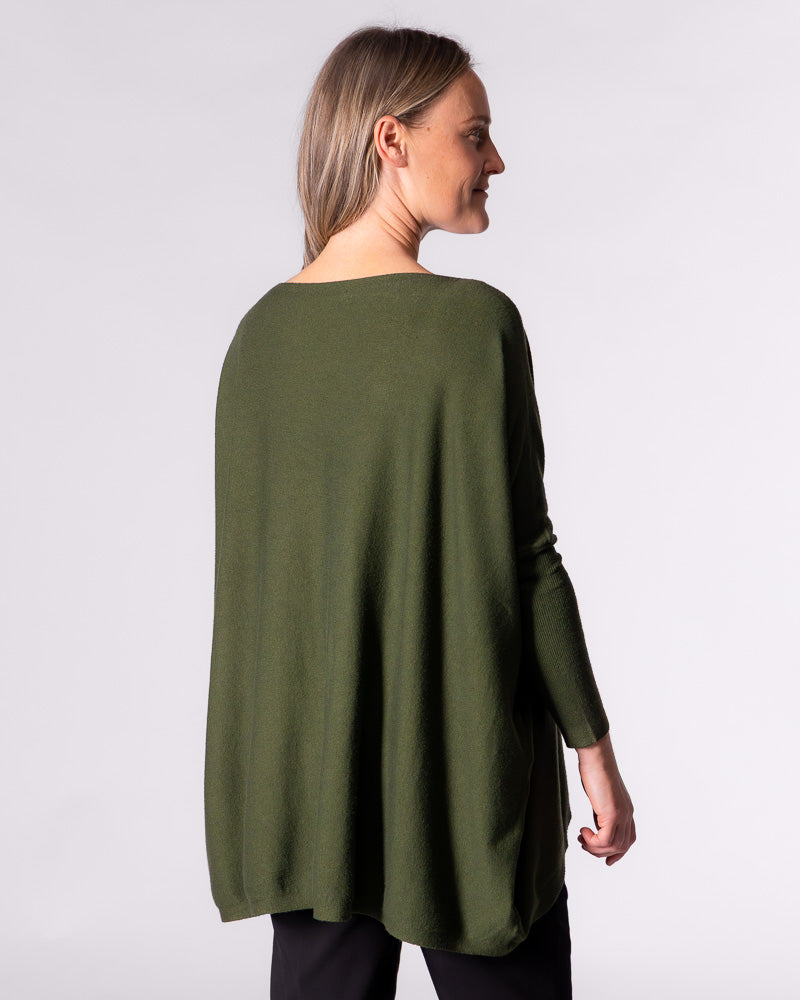 Rear angle of the Karma Kameleon khaki jumper, highlighting the extended drape back hemline and relaxed fit.