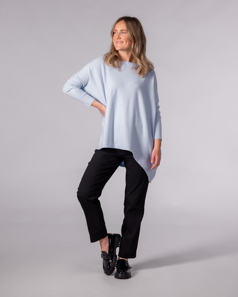 Light blue oversized cotton jumper featuring a wide boat neckline, drop shoulders, and long fitted sleeves.