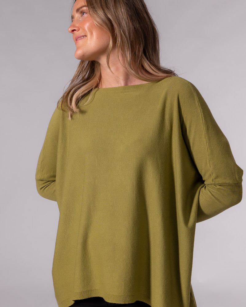 Olive green cotton jumper showcasing a wide boat neckline, drop shoulders, and an oversized draped fit.