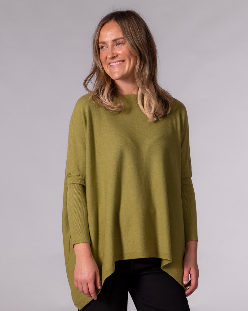 Oversized olive green cotton jumper with a boat neckline, draped body, and drop shoulders with fitted ribbed sleeves.
