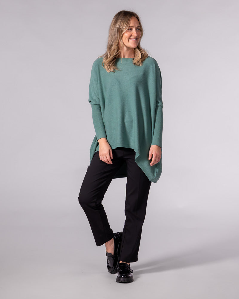 Oversized sage green cotton jumper with a wide boat neckline, drop shoulders, fitted sleeves and a draped hi-low hem.