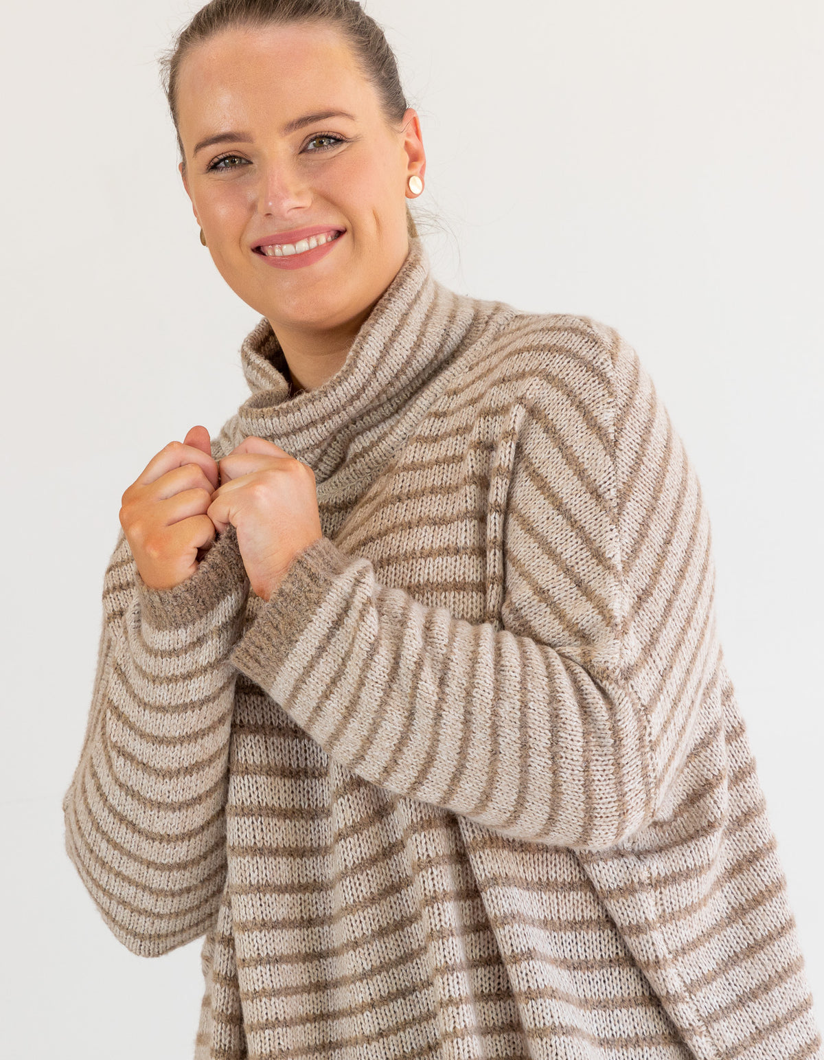 Front half-body shot of the Karma Kameleon beige and mocha stripe jumper showcasing the soft brushed knit.